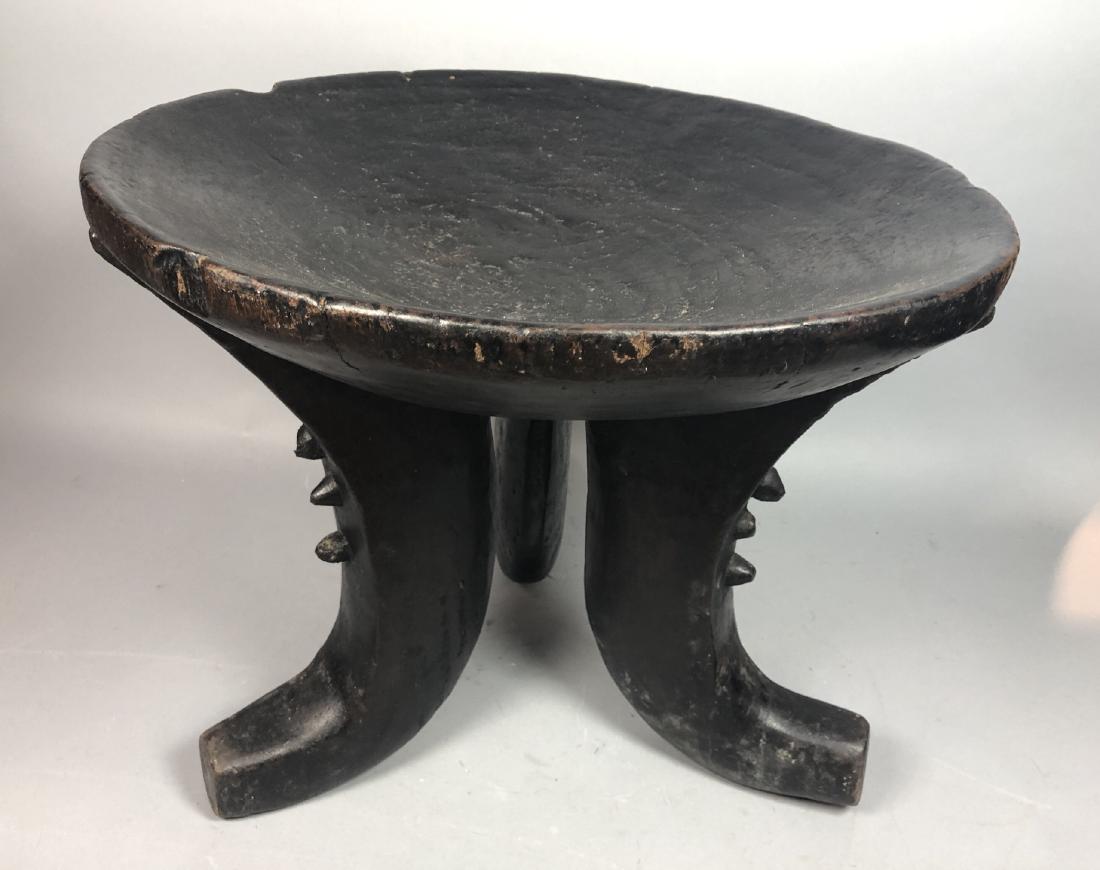 Tribal Lacquered Wood Footed Bowl Stand. Wide sha: Tribal Lacquered Wood Footed Bowl Stand. Wide shallow wood bowl on 3 arched carved legs. Ebonized finish.-- Dimensions: H: 18.5 inches: W: 23 inches: D: 23 inches ---