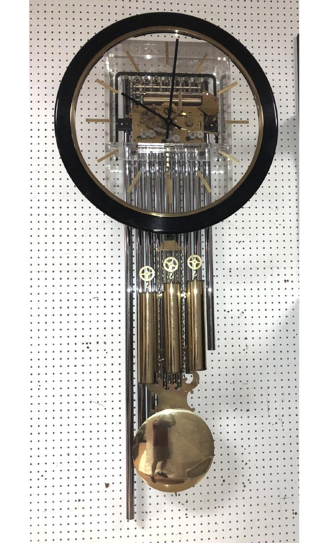 HOWARD MILLER Lucite Chrome Pendulum Clock. Focal