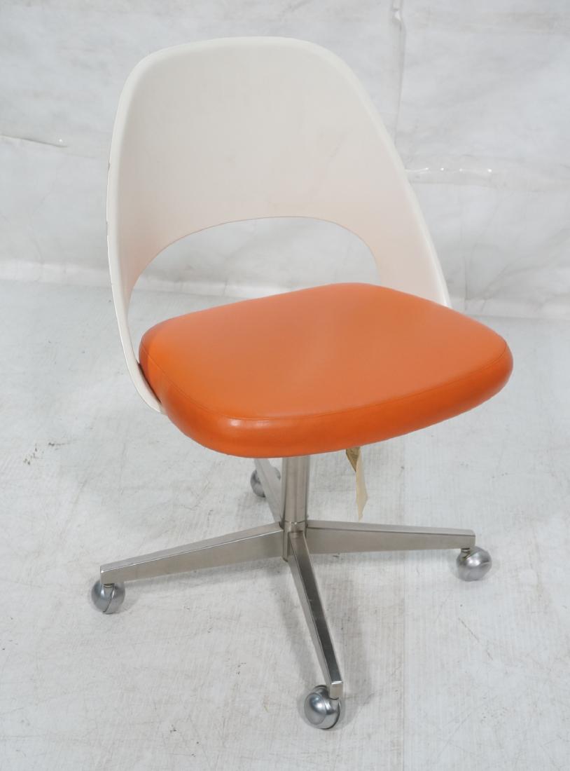 EERO SAARINEN for KNOLL Fiberglass Desk Chair. Mo: EERO SAARINEN for KNOLL Fiberglass Desk Chair. Modernist Rolling Lounge Chair. Orange vinyl seat. Stainless pedestal base with wheels. Knoll label.-- Dimensions: H: 34 inches: W: 22 inches: D: 20 inch
