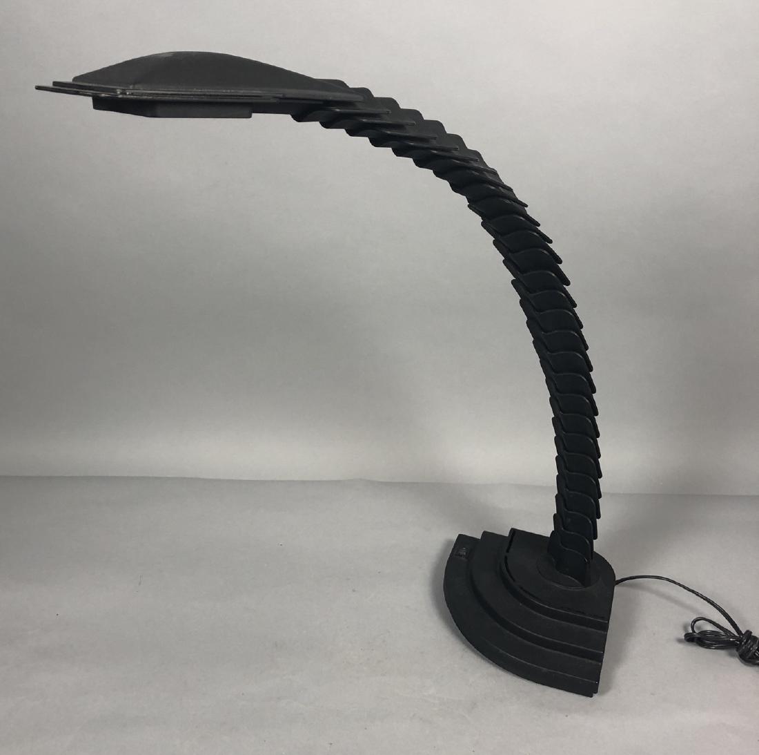 MASSANDABO Italian 'Proteo' Lamp. Armadillo scale: MASSANDABO Italian 'Proteo' Lamp. Armadillo scale form flexible arm lamp. Black plastic. Designed by Mario Bertorelle. Marked.-- Dimensions: H: 20.5 inches: W: 24 inches: D: 11.5 inches ---