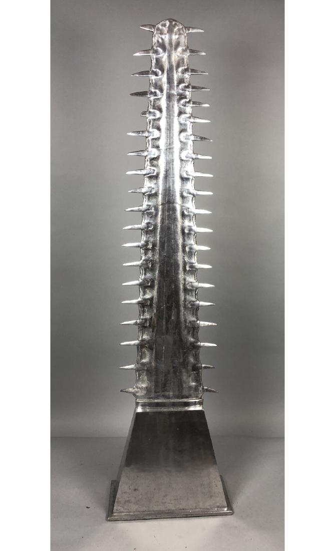 ARTHUR COURT Saw Tooth Metal Table Sculpture. Dra: ARTHUR COURT Saw Tooth Metal Table Sculpture. Dramatic sculpture on trapezoidal base. 1976 Arthur Court. -- Dimensions: H: 41.5 inches: W: 11 inches: D: 5.5 inches ---