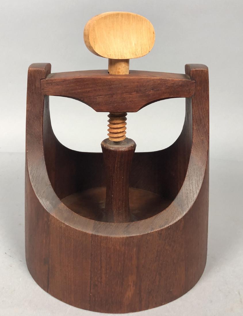 JENS QUISTGAARD Staved Teak Modernist Nutcracker.: JENS QUISTGAARD Staved Teak Modernist Nutcracker. Teak form with blond wood screw nutcracker. Branded mark.-- Dimensions: H: 10 inches: W: 8.5 inches: D: 8.5 inches ---
