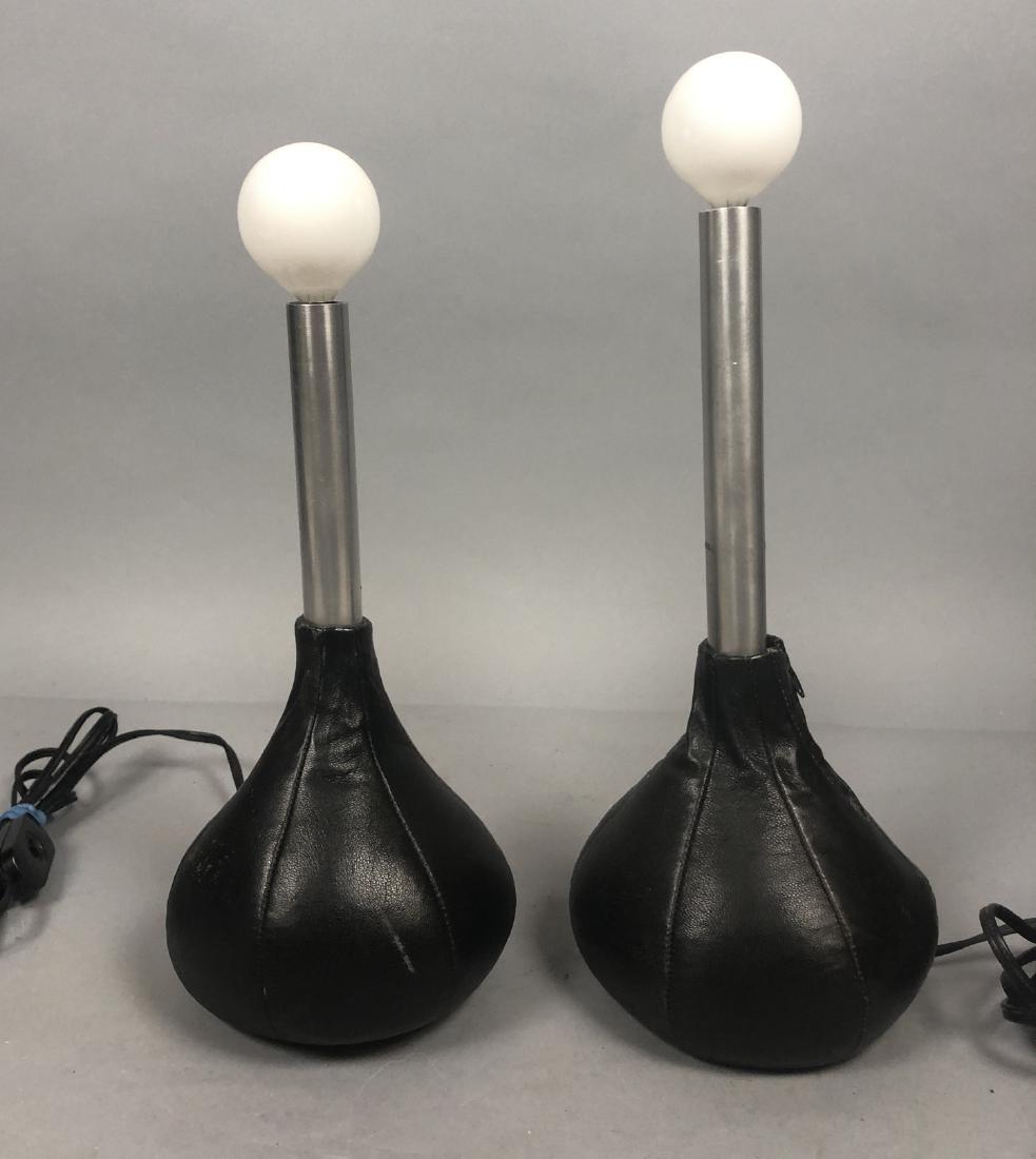 Pr Modernist Leather Bag Lamps. Arredoluce Style: Pr Modernist Leather Bag Lamps. Arredoluce Style Unmarked. Stitched black leather weighted bases with aluminum column bulb holders.-- Dimensions: H: 13.5 inches: W: 5.5 inches: D: 5.5 inches ---