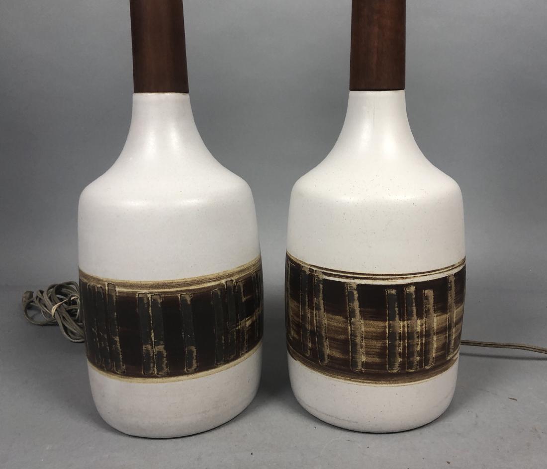 Pr MARTZ Pottery Table Lamps for MARSHALL STUDIOS: Pr MARTZ Pottery Table Lamps for MARSHALL STUDIOS. Off white background, incised brown and black band. Walnut trim. Original finials. Signed.-- Dimensions: H: 26.5 inches: W: 6 inches: D: 6 inches ---