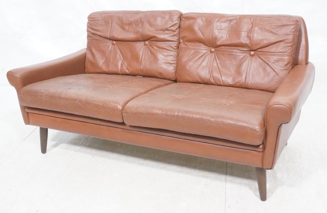 Cordovan Leather SVEND SKIPPER Love Seat. Quilted: Cordovan Leather SVEND SKIPPER Love Seat. Quilted tufted cushions, narrow leather arms, tapered peg legs.-- Dimensions: H: 27 inches: W: 57.5 inches: D: 30.5 inches ---