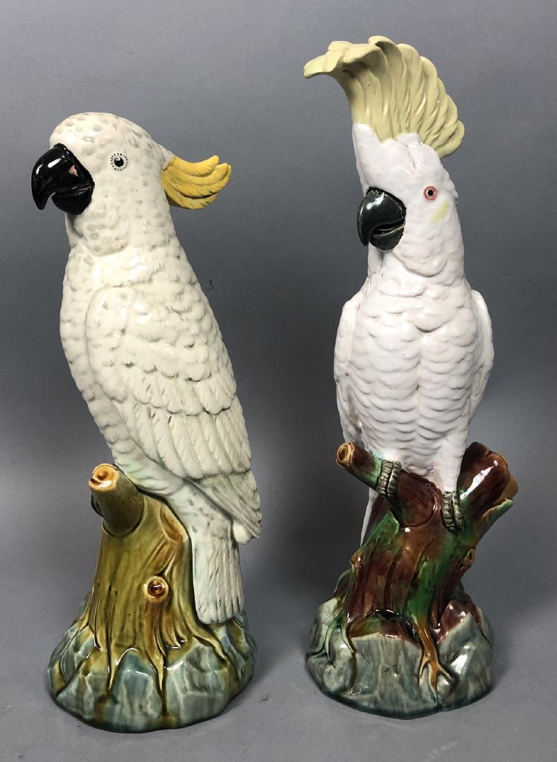 2 Majolica Cockatoo Bird Sculptures Figures. Whit: 2 Majolica Cockatoo Bird Sculptures Figures. White birds with yellow plumes on a branch form base. Neither is marked. 1 has a Strawser Auction label.-- Dimensions: H: 13.25 inches: W: 4.5 inches: D: 4