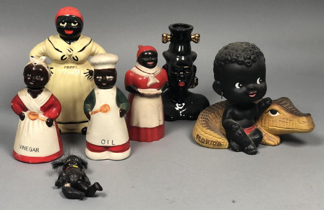 7pc Lot Vintage Black Americana. Mammy "Peppy" la: 7pc Lot Vintage Black Americana. Mammy "Peppy" large pepper shaker. Jointed porcelain doll painted black with bead necklace. Mammy oil and vinegar cruet set. Pottery tribal woman bud vase. Baby nodder