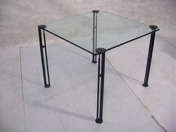 ETTORE SOTTSASS Glass dining table. 3/4 inch glass: ETTORE SOTTSASS Glass dining table. 3/4 inch glass with movable metal legs. Dimensions: H: 28.75 inches: W: 36 inches Condition: Excellent condition. US Shipping charge: Pick up or shipping quote from