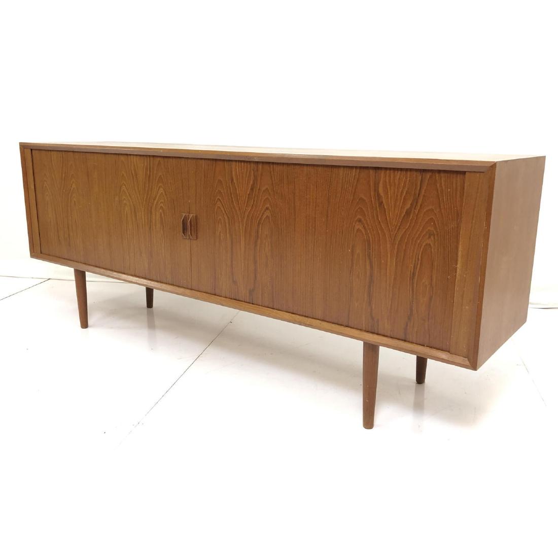 Danish Modern Teak Credenza Sideboard. Sliding Ta: Danish Modern Teak Credenza Sideboard. Sliding Tambour Doors. Raised on tapered peg legs. Interior drawers. Danish control mark. -- Dimensions: H: 32 inches: W: 80 inches: D: 19 inches ---