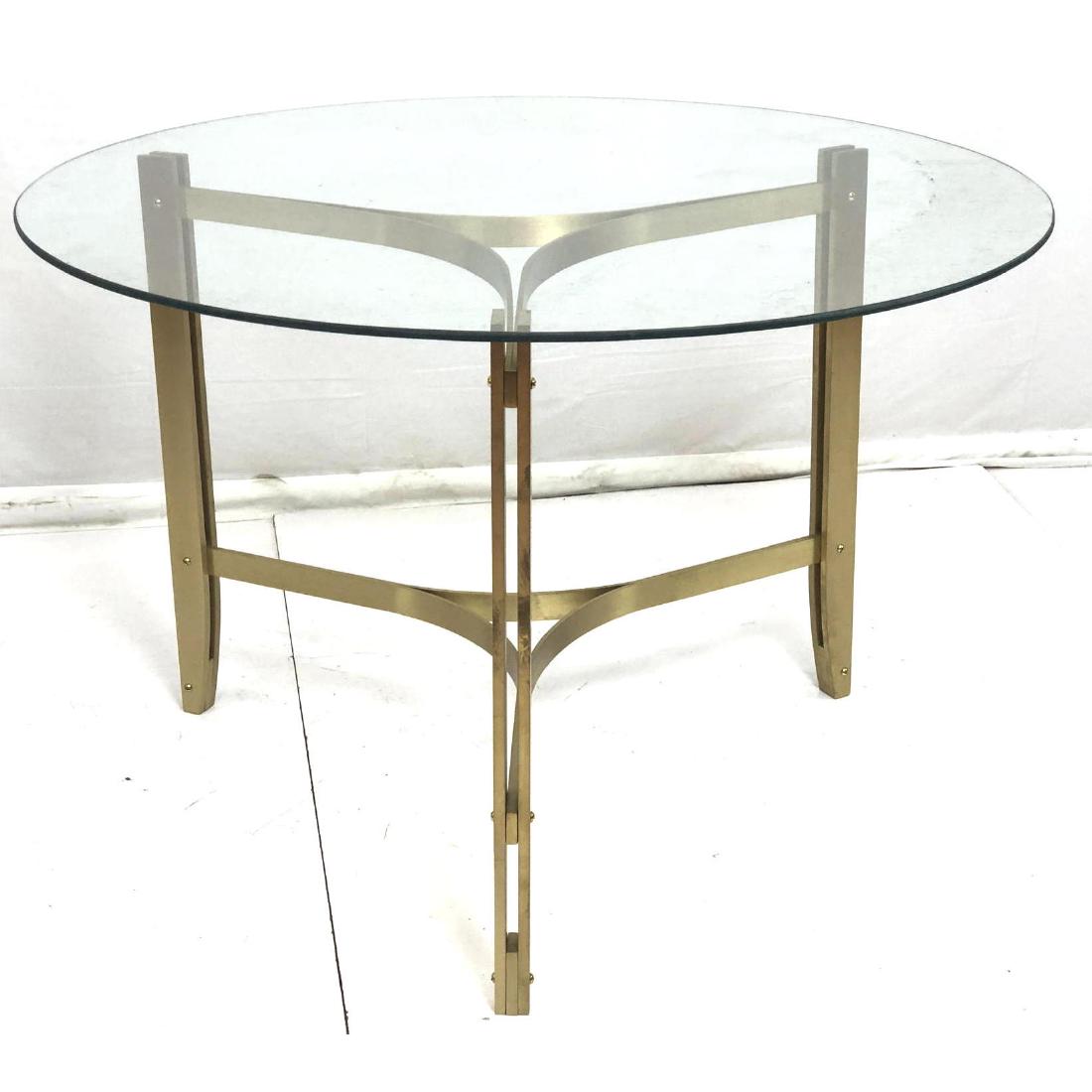 Glass Top Gilt Aluminum Modernist Dining Table. 4: Glass Top Gilt Aluminum Modernist Dining Table. 40" round top on tripod base with bowed stretcher. -- Dimensions: H: 30 inches: W: 40 inches: D: 40 inches ---