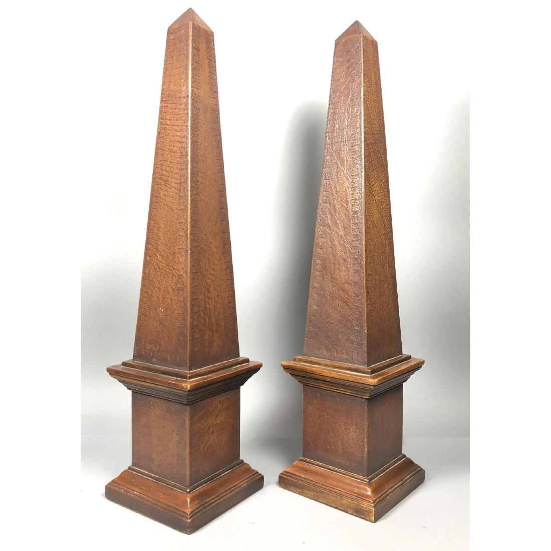 Pr Tall Decorator Faux Leather Obelisk Table Scul: Pr Tall Decorator Faux Leather Obelisk Table Sculptures. Deep wood molded trim.-- Dimensions: H: 31.5 inches: W: 7.25 inches: D: 7.25 inches ---
