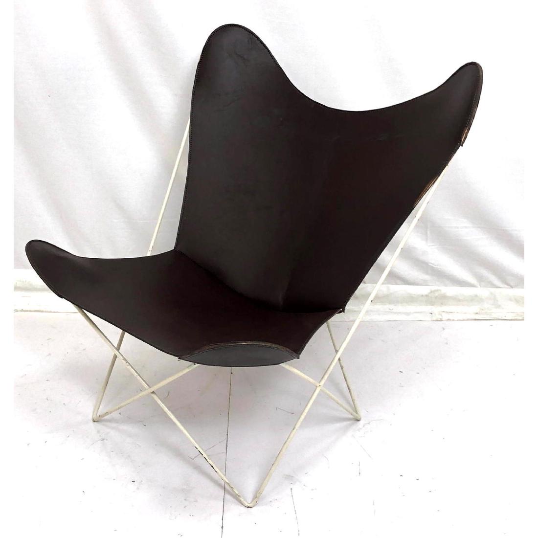 Brown Leather White Iron Frame Butterfly Chair. M: Brown Leather White Iron Frame Butterfly Chair. Modernist lounge chair. Off white canvas butterfly sling included. -- Dimensions: H: 36 inches: W: 32 inches: D: 27 inches ---