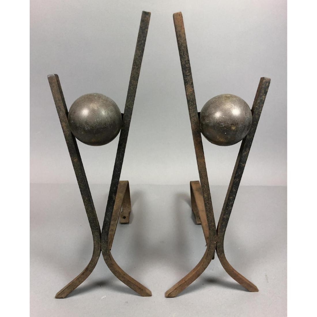 Pr Modernist Metal Ball Andirons. Metal sphere su: Pr Modernist Metal Ball Andirons. Metal sphere suspended in Y frame. -- Dimensions: H: 19.5 inches: W: 6.5 inches: D: 13 inches ---