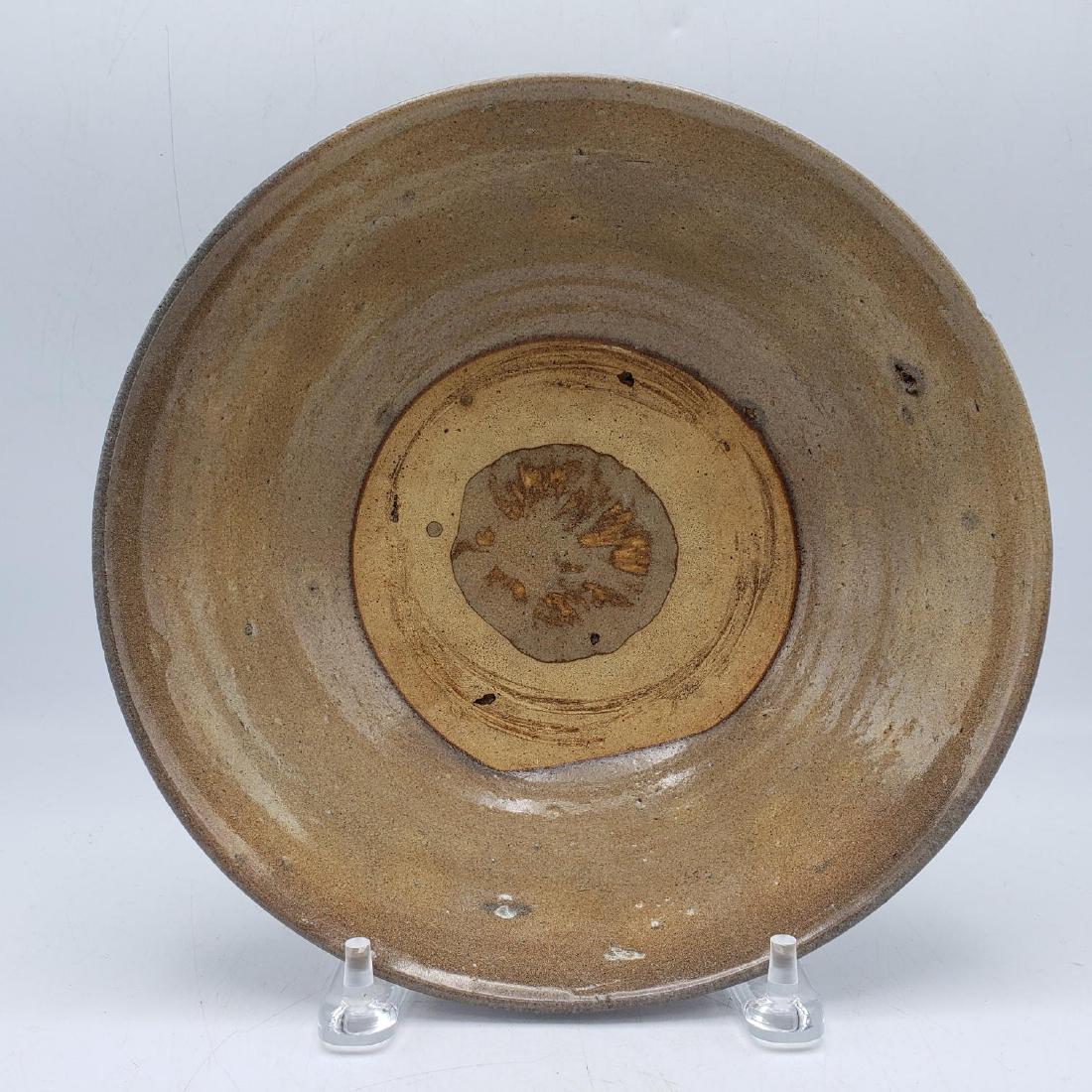 Brown Glazed Chinese Pottery Bowl. Unglazed cente: Brown Glazed Chinese Pottery Bowl. Unglazed center ring. Not marked-- Dimensions: H: 3.25 inches: W: 10 inches: D: 10 inches ---