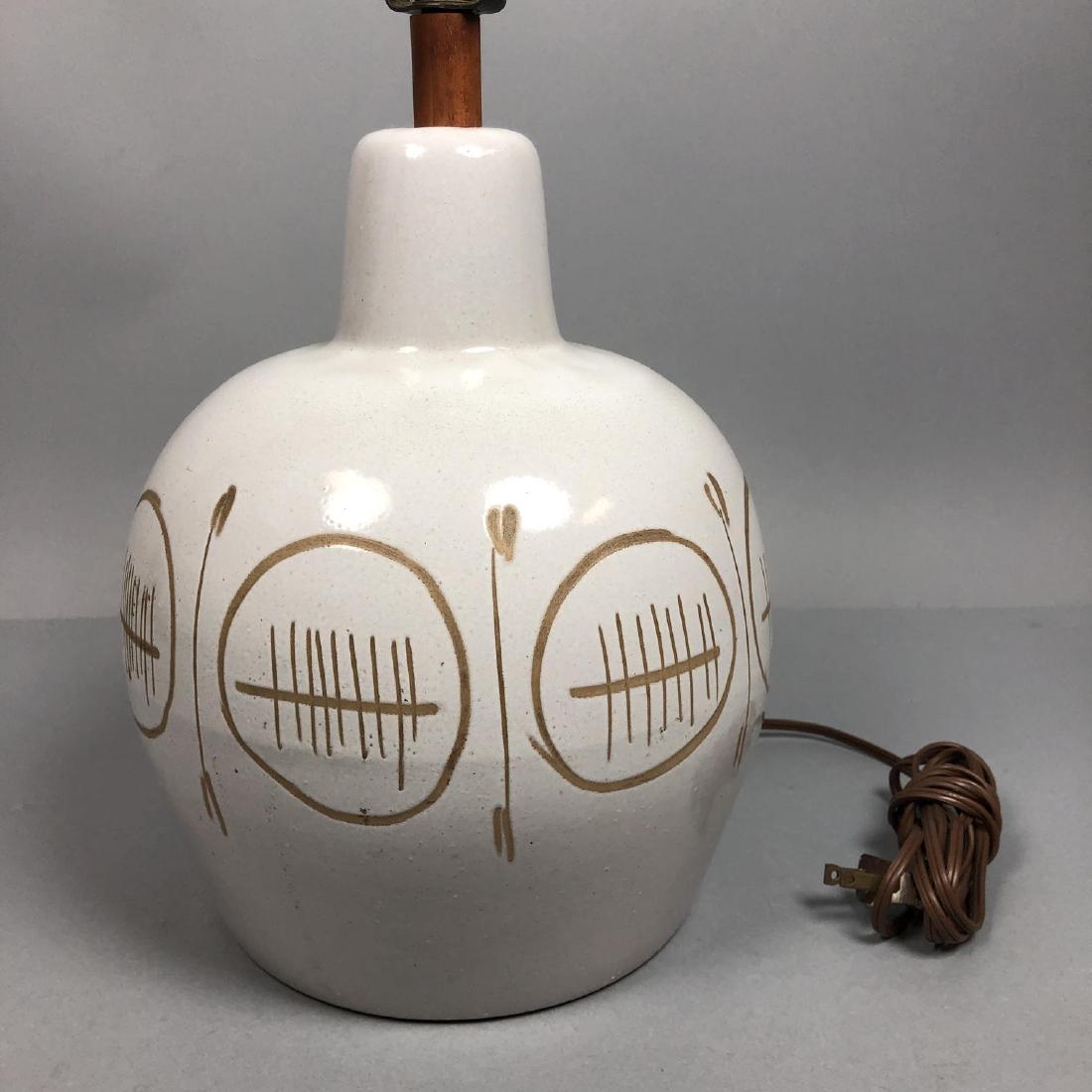 MARTZ for MARSHALL STUDIOS Incised Pottery Table: MARTZ for MARSHALL STUDIOS Incised Pottery Table Lamp. Glazed bulbous form with incised modernist design. Walnut trim and finial. Marked.-- Dimensions: H: 23.75 inches: W: 9 inches: D: 9 inches ---