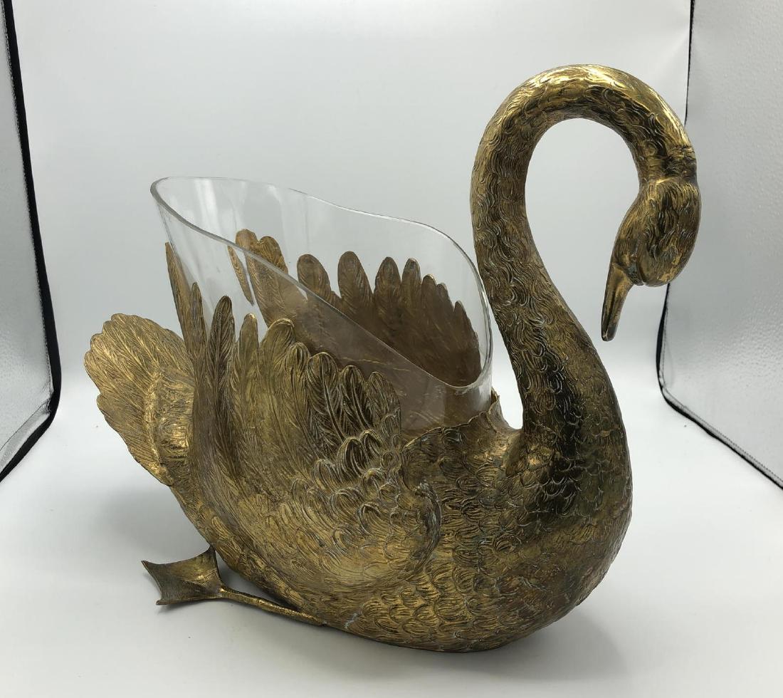 Gilt Metal Figural Swan Ice Bucket. ETS Alpacca.: Gilt Metal Figural Swan Ice Bucket. ETS Alpacca. Large swan form vessel with shaped interior glass lining. Marked.-- Dimensions: H: 12 inches: W: 16.5 inches: D: 7.5 inches ---
