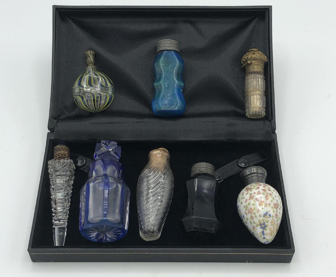8 Antique & Vintage Perfume Flasks Bottles. Mixed: 8 Antique & Vintage Perfume Flasks Bottles. Mixed medium. 7 crystal and glass vials; 1 porcelain. -- Dimensions: H: 3.75 inches: W: 0.75 inches: D: 0.75 inches --- US Shipping charge: $35