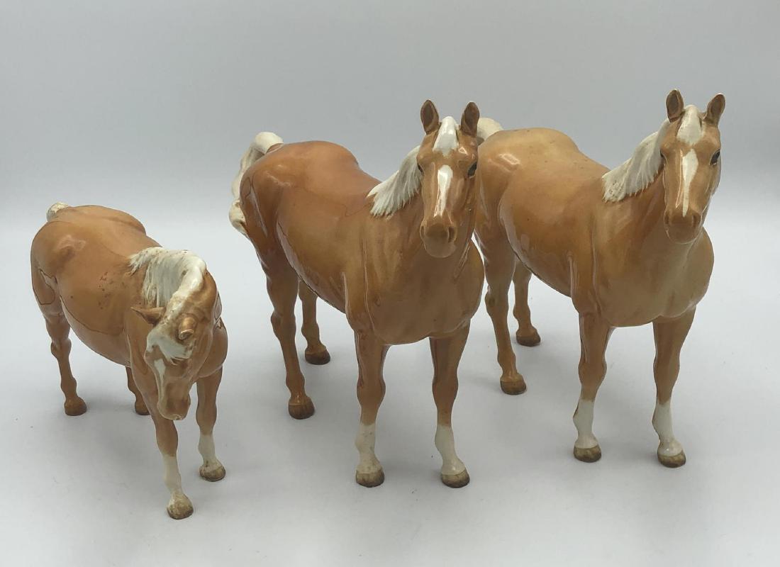 3pc BESWICK England Horse Figures. 2 light brown: 3pc BESWICK England Horse Figures. 2 light brown matching horses and a small horse, all marked.-- Dimensions: H: 8.75 inches: W: 10.25 inches: D: 2.75 inches ---