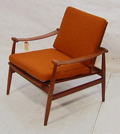 FINN JUHL France And Sons Lounge Chair. Teak Frame: FINN JUHL France And Sons Lounge Chair. Teak Frame with wide arms. Rust Orange Upholstery. France and Sons metal Tag. Dimensions: H: 31 inches: W: 29 inches: D: 29 inches Condition: Very Good Conditio