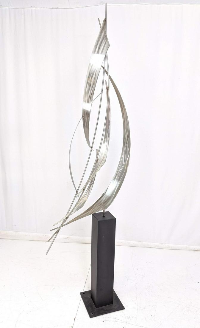 Signed C JERE Stainless "Sails" 91" Tall Sculptur: Signed C JERE Stainless "Sails" 91" Tall Sculpture. Pivots on square black metal base supports sweeping sculpture of engine turned sail ribbons. Signed C Jere 2004.-- Dimensions: H: 91 inches: W: 26 i