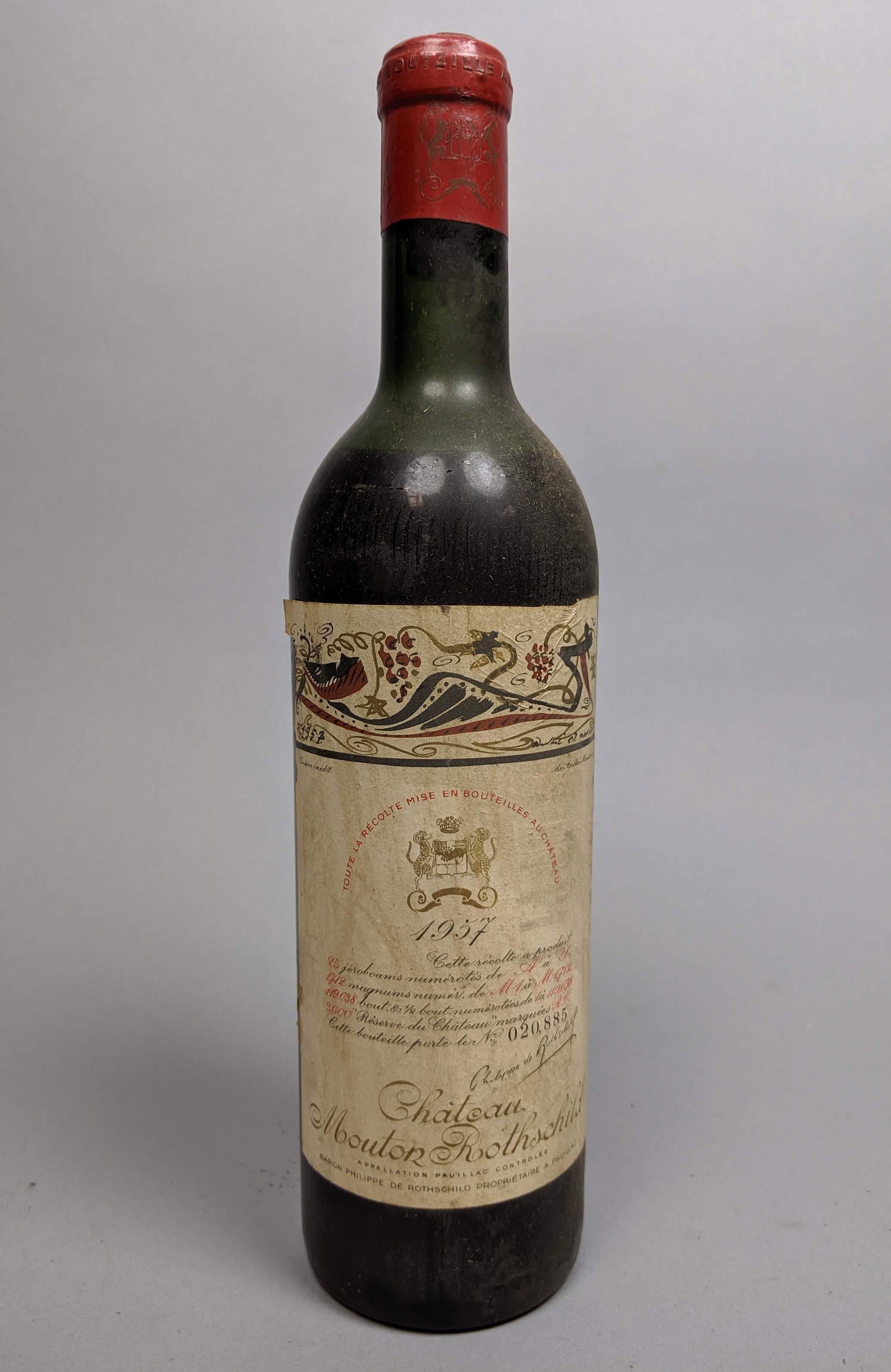 CHATEAU MOUTON ROTHSCHILD 1957 Wine Bottle. Seale: CHATEAU MOUTON ROTHSCHILD 1957 Wine Bottle. Sealed. -- Dimensions: H: 12 inches: W: 3 inches ---