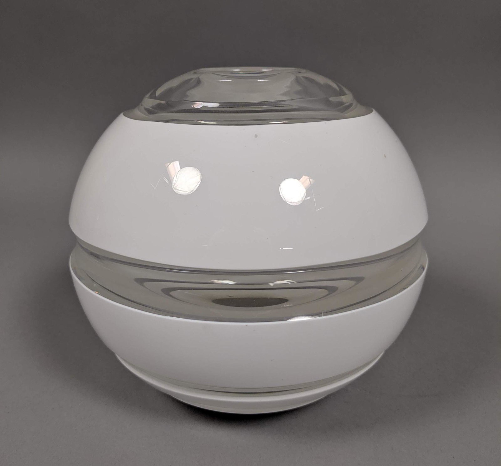 ORREFORS STUDIO by LENA BERGSTROM Art Glass Vase.: ORREFORS STUDIO by LENA BERGSTROM Art Glass Vase. Spherical cased glass vase with opaque white bands. Modernist Swedish Art. Signed; 1998. 917486 Lena Bergstrom 1-20. -- Dimensions: H: 5.5 inches: W: 