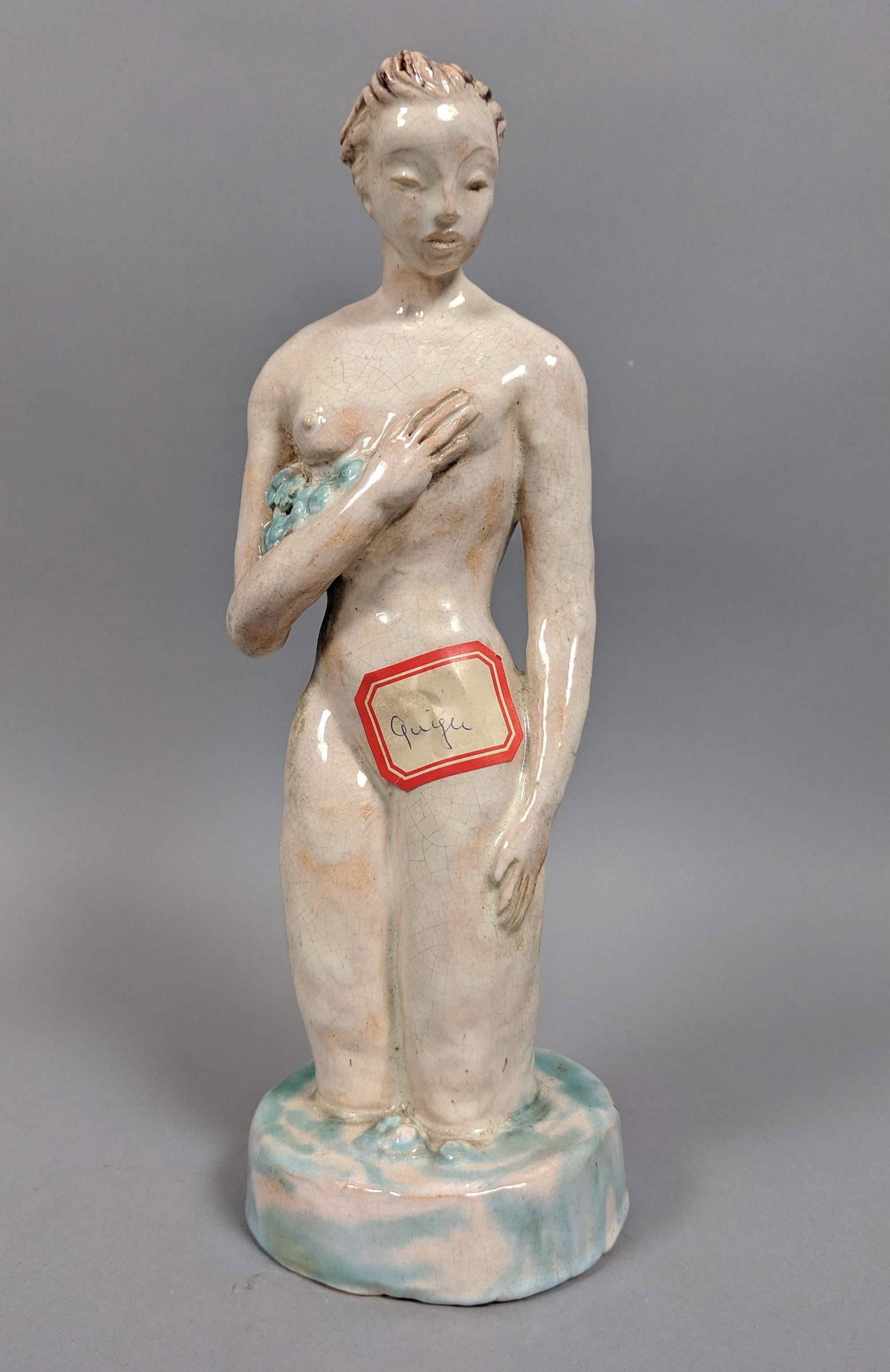 Signed KOSSY Figural Glazed Nude Sculpture. Femal: Signed KOSSY Figural Glazed Nude Sculpture. Female nude with blue flowers. In the manner of Austrian Wiener Werkstatte. Signed Kossy. -- Dimensions: H: 10.75 inches: W: 3.75 inches: D: 3.25 inches ---