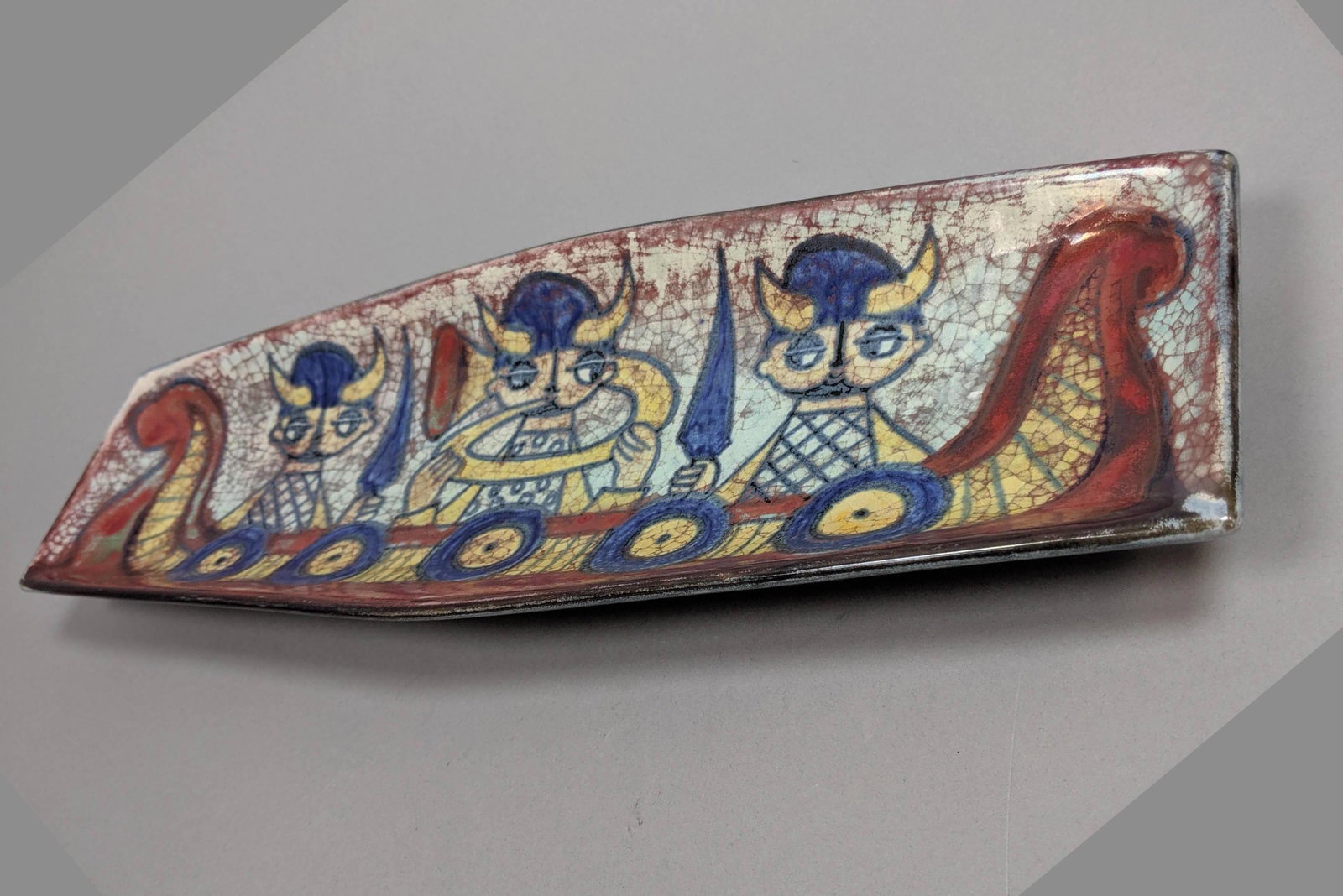 MICHAEL ANDERSEN & SON Pottery Dish. Colorful gla: MICHAEL ANDERSEN & SON Pottery Dish. Colorful glazed bowl with viking ship and vikings. Paper label. Impressed mark 5661-1. Fish and triangle mark. Denmark. -- Dimensions: H: 1.5 inches: W: 16.5 inche