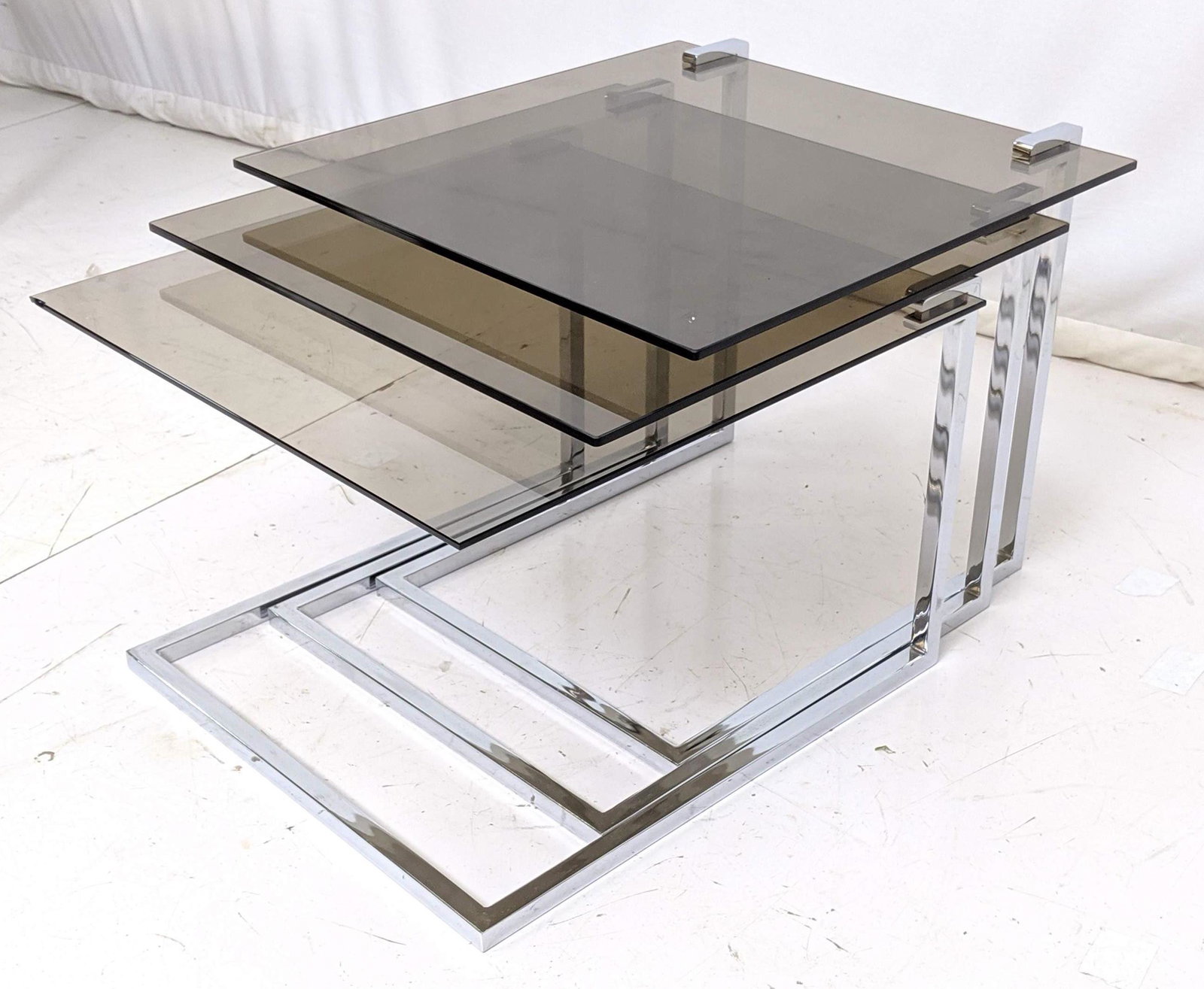 Set of 3 Smoked Glass Chrome Nesting Tables. Suspended (1 of 7)