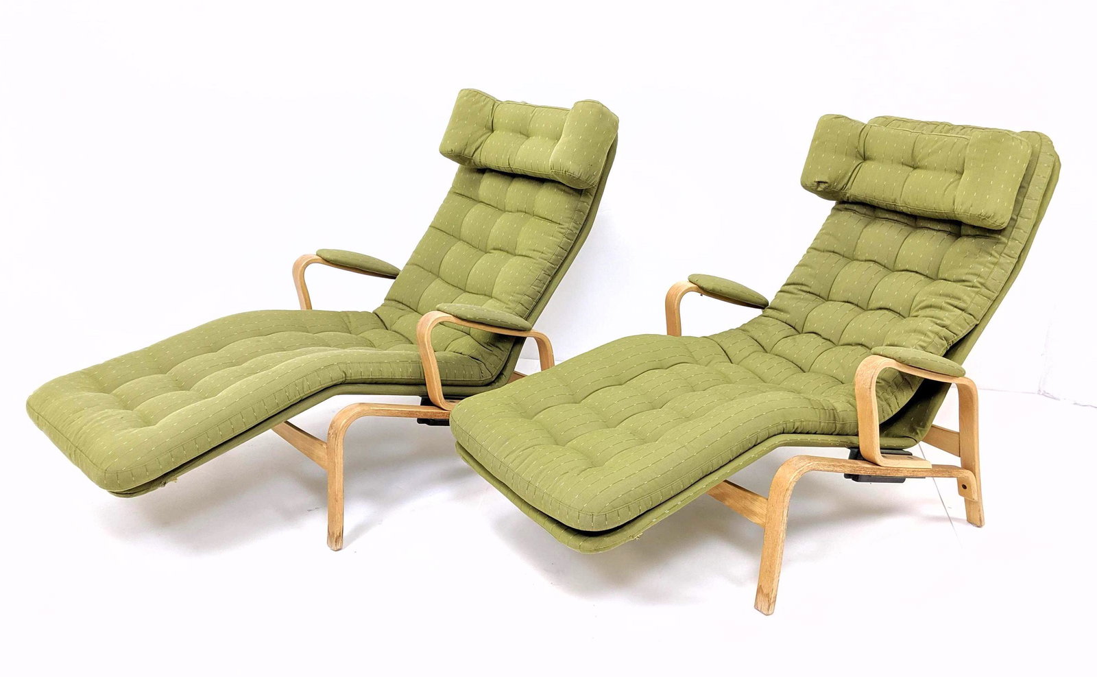 Pr BRUNO MATHSSON Chaise Lounges. Modernist LAMINATED W: Pr BRUNO MATHSSON Chaise Lounges. Modernist LAMINATED WOOD FRAMES WITH TUFTED GREEN FABRIC CUSHIONS. Padded Fabric Arms. -- Dimensions: H: 37 inches: W: 27 inches: D: 53 inches ---