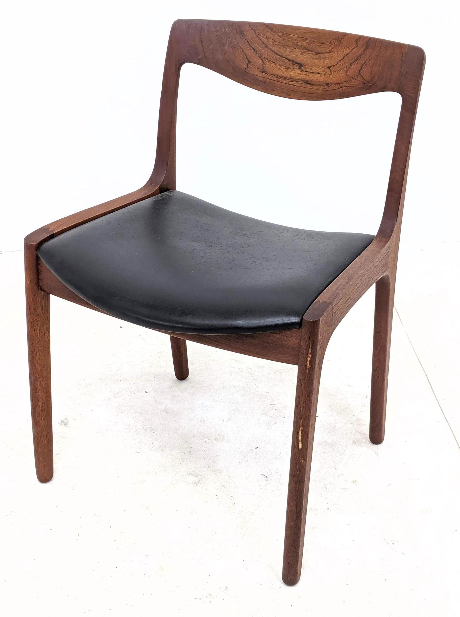 PJ Danish Modern Teak Side Chair. Sculpted frame with c: PJ Danish Modern Teak Side Chair. Sculpted frame with curved back. after Moller in teak and black leather upholstery. Marked. -- Dimensions: H: 30 inches: W: 21 inches: D: 20 inches ---