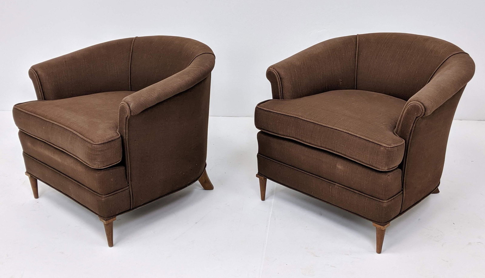Pr Brown Fabric Barrel Back Lounge Chairs. Modernist ta: Pr Brown Fabric Barrel Back Lounge Chairs. Modernist tapered wood peg legs. Not marked-- Dimensions: H: 26.5 inches: W: 30 inches: D: 31 inches ---