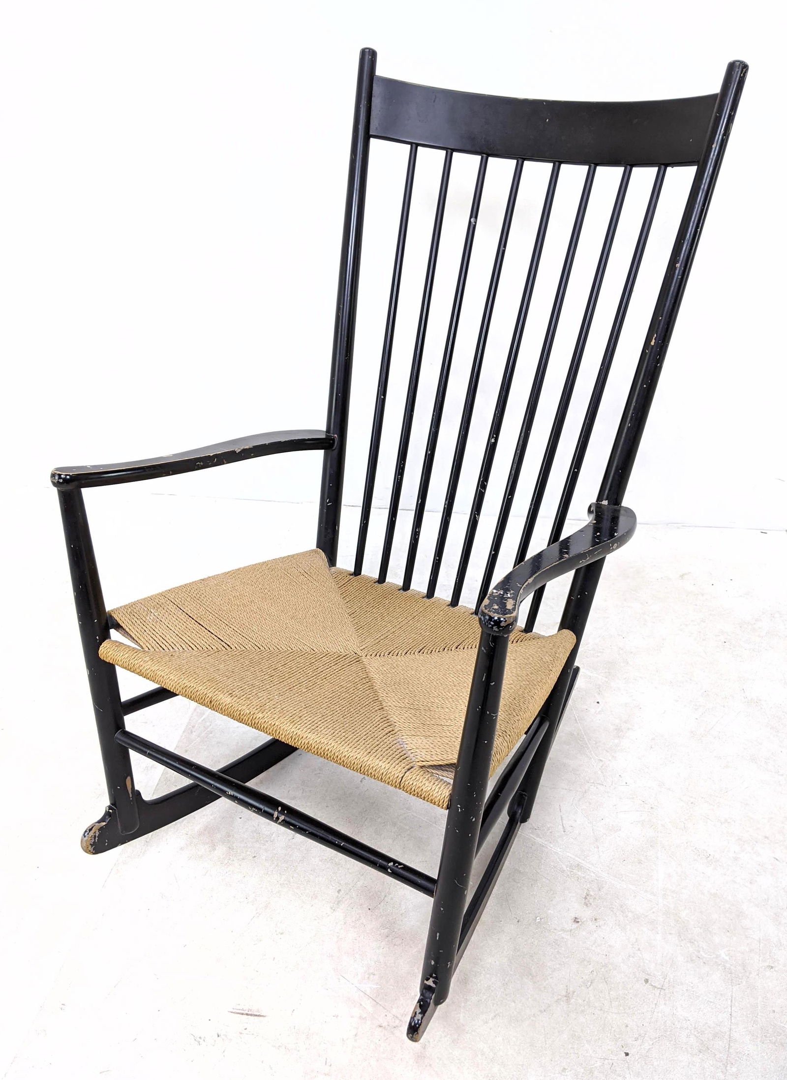 Hans Wegner Danish Modern Rocking Chair. Woven seat, pa: Hans Wegner Danish Modern Rocking Chair. Woven seat, painted black finish.-- Dimensions: H: 44 inches: W: 25 inches: D: 31 inches ---