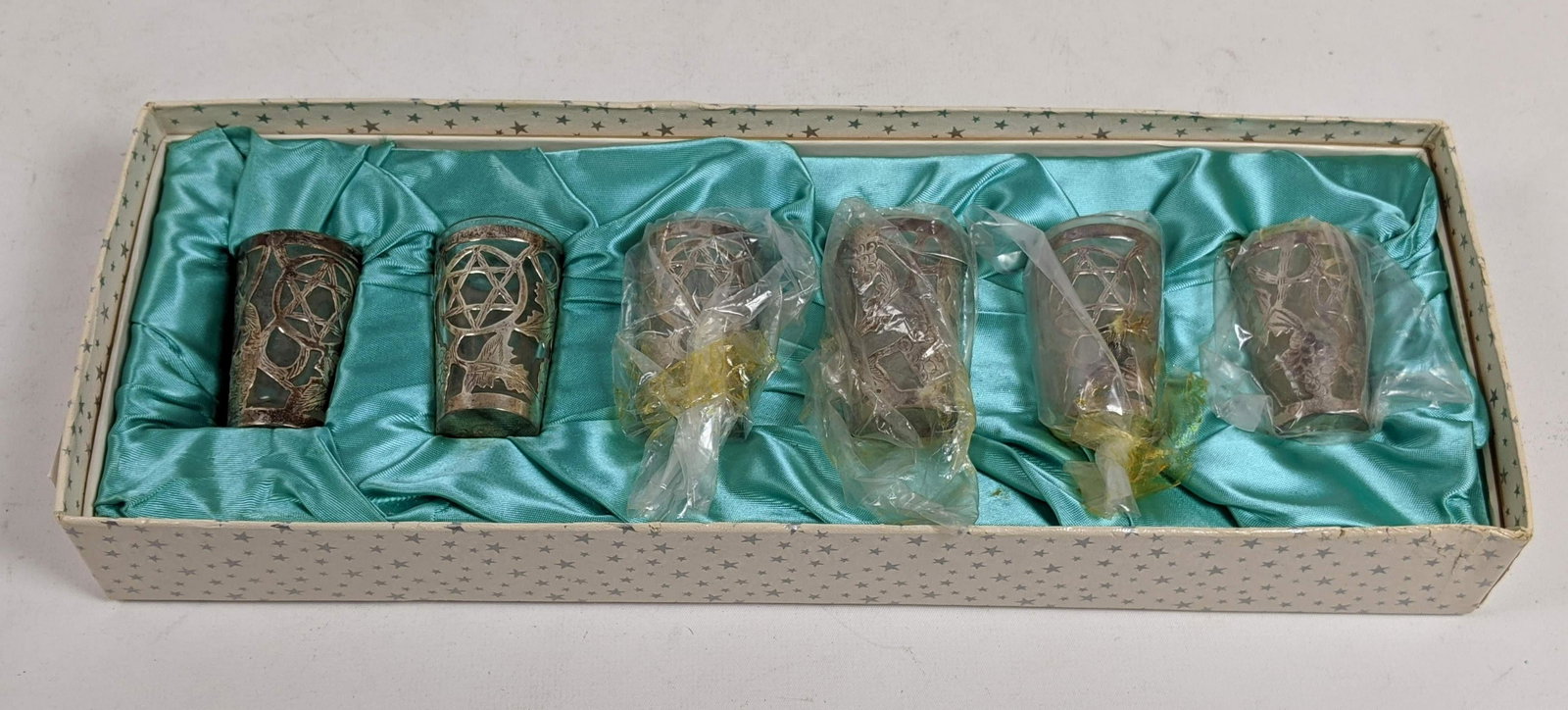 6pc Sterling Silver Overlay Judaica Cordial Glasses. AR: 6pc Sterling Silver Overlay Judaica Cordial Glasses. ART Mexican shot wine glasses. Sterling overlay with Star of David and grape designs. Marked. In a fitted box. -- Dimensions: --- US Shipping charg