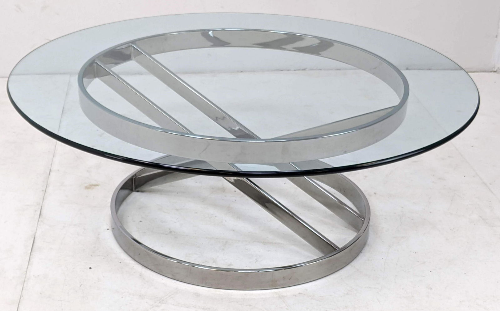 70s Modern Flat Chrome & Glass Top Coffee Cocktail Tabl: 70s Modern Flat Chrome & Glass Top Coffee Cocktail Table. Possibly DIA. -- Dimensions: H: 16 inches: W: 42 inches: D: 42 inches ---