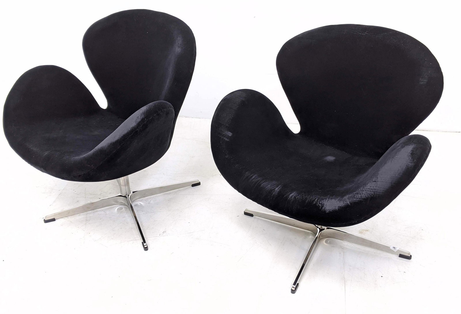 Pr Contemporary Arne Jacobsen style Swan Swivel Chairs.: Pr Contemporary Arne Jacobsen style Swan Swivel Chairs. Black velvet upholstery.-- Dimensions: H: 29 inches: W: 28 inches: D: 26 inches ---