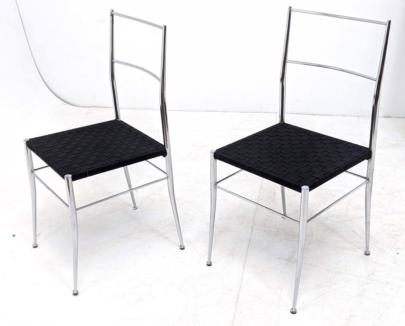 PR Anton Lorenz style chrome chairs Gio Ponti Style Chr: PR Anton Lorenz style chrome chairs Gio Ponti Style Chrome & Woven Side Chairs. Newly uphostered.-- Dimensions: H: 34 inches: W: 16 inches: D: 17 inches ---
