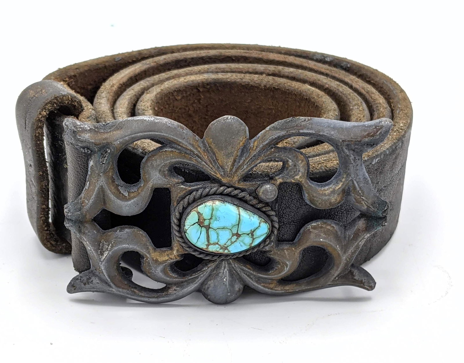 Native American Indian Sand Cast Turquoise Belt Buckle.: Native American Indian Sand Cast Turquoise Belt Buckle. Turquoise center stone in sand cast buckle. 1.5" wide pebbled leather belt. No marks found. Belt buckle 2.23" high x 3.5" wide. -- Dimensions: :