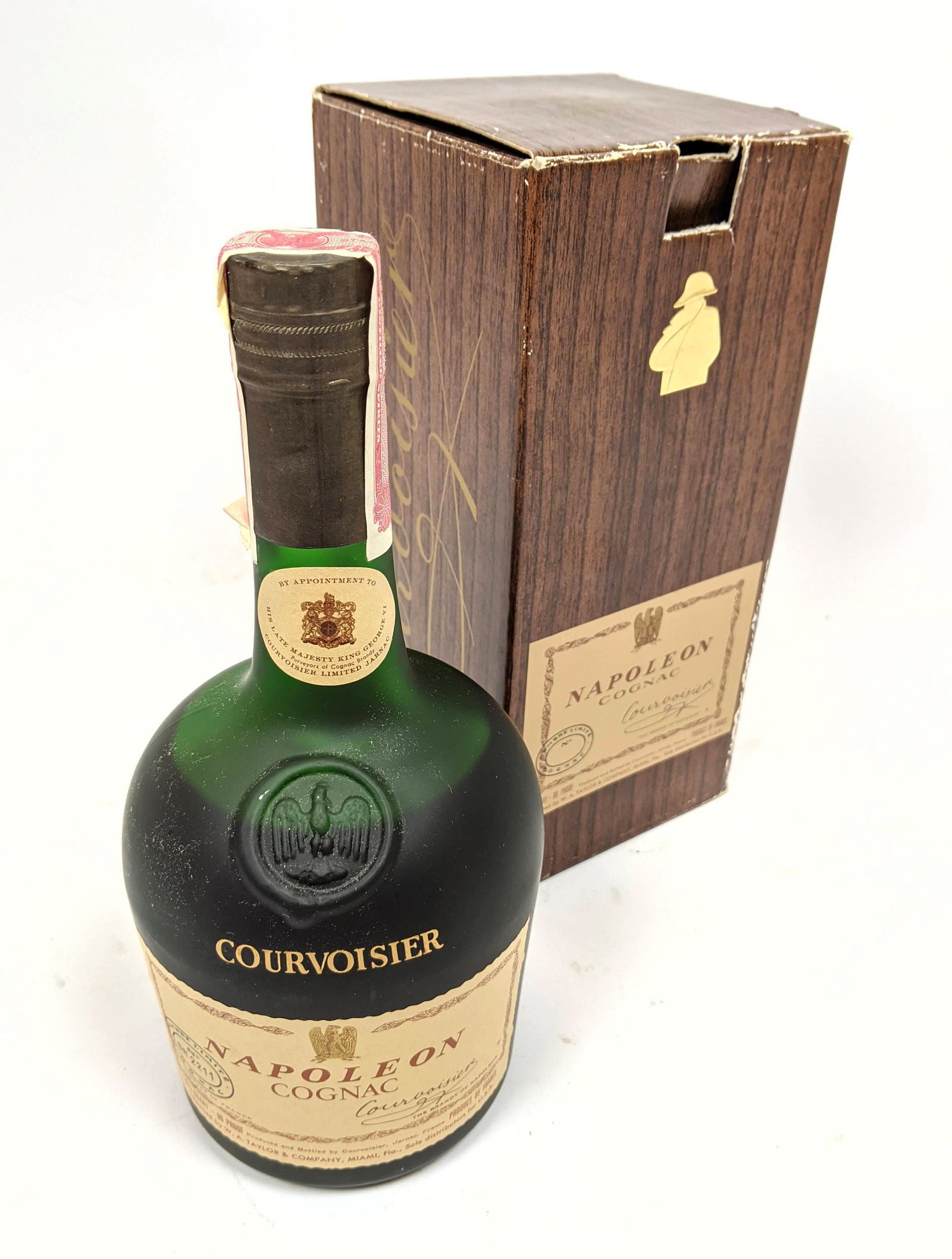 COURVOISIER Vintage Bottle of Napoleon Cognac.: COURVOISIER Vintage Bottle of Napoleon Cognac.-- Dimensions: H: 9.5 inches: W: 4.5 inches: D: 4.5 inches ---
