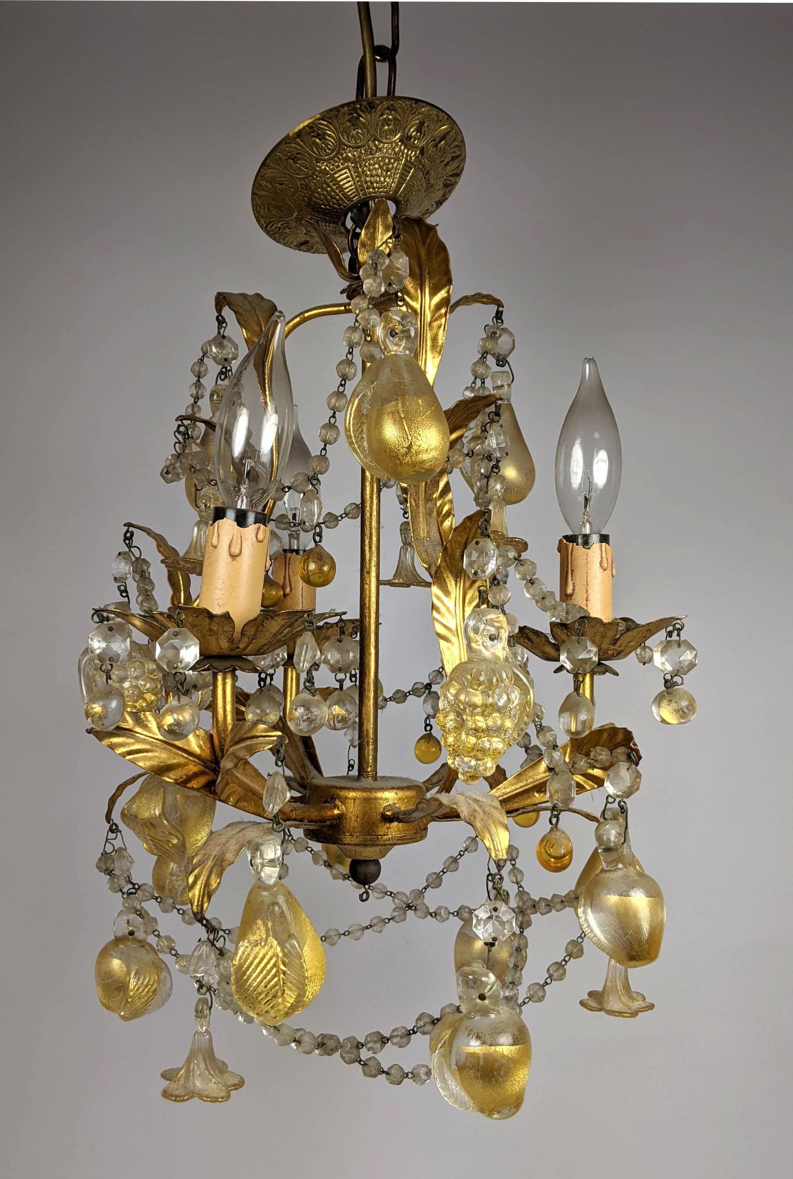 Delicate Glas Fruit Pendant Chandelier Light. Gold Gil: Delicate Glas Fruit Pendant Chandelier Light. Gold Gilt Metal and Gold Foil Glass Chandelier. Prisms are flowers and fruits. -- Dimensions: H: 18 inches: W: 13 inches: D: 13 inches ---