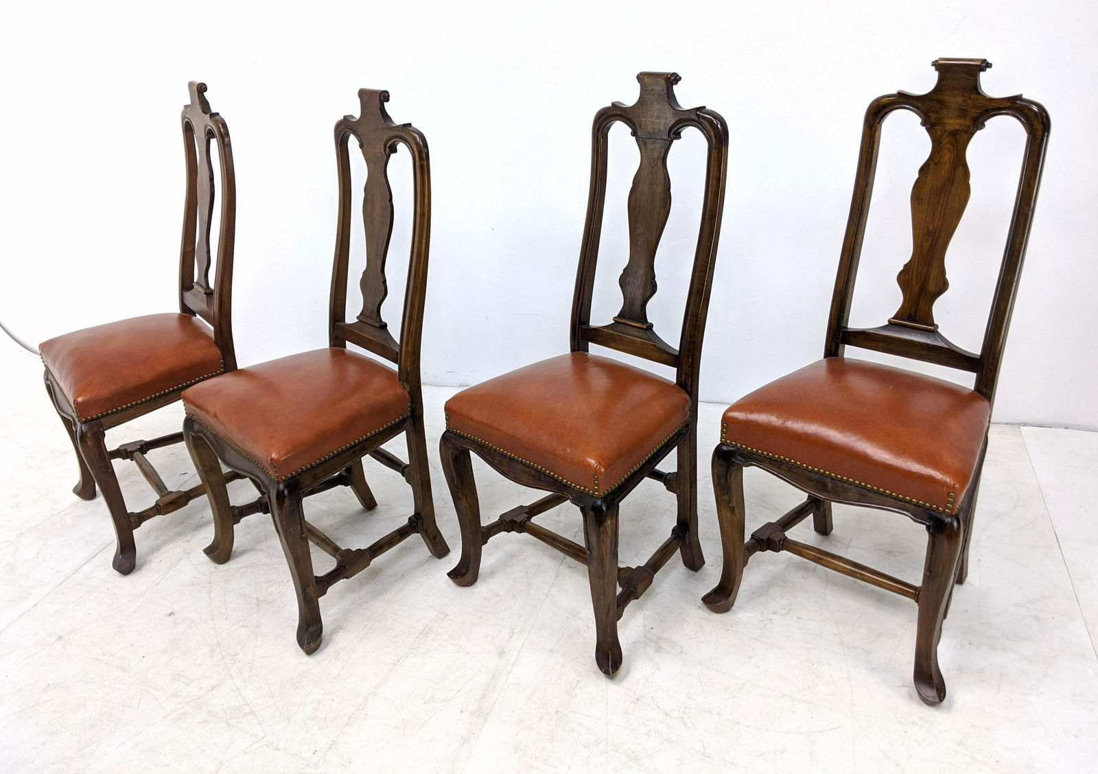 4pc Antique Dining Side Chairs with Scroll carved Tops.: 4pc Antique Dining Side Chairs with Scroll carved Tops. Leather upholstery with brass tack edges. -- Dimensions: H: 45 inches: W: 20 inches: D: 18 inches ---