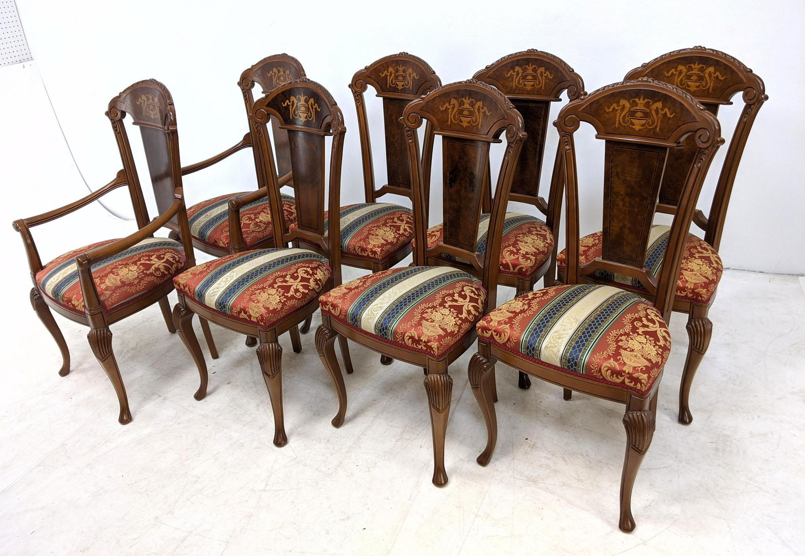 8 Italain Style Carved and Inlaid Dining Chairs. Burl b: 8 Italain Style Carved and Inlaid Dining Chairs. Burl backs with decorative inlay. Two with arms.-- Dimensions: H: 41 inches: W: 22 inches: D: 22 inches ---
