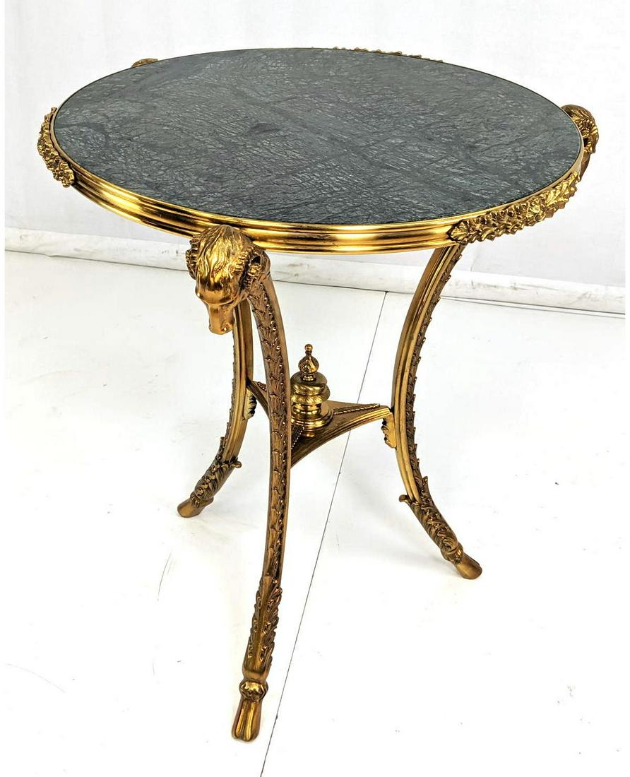 Decorator Gold Metal and Green Tabletop Pedestal Table.: Decorator Gold Metal and Green Tabletop Pedestal Table. Ram head decoration with leaf designs. Hoofed feet.-- Dimensions: H: 29 inches: W: 28 inches: D: 28 inches ---