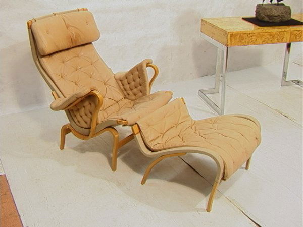 Bruno Mathsson Lounge Chair and Ottoman Pernilla.: Bruno Mathsson Lounge Chair and Ottoman Pernilla. Tan Leather Cushions. Marked. Dimensions: H: 37.5 inches: W: 36 inches: D: 34 inches Condition (General) Please contact us for a detailed condition re