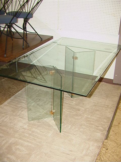 Large Beveled Plate Glass Dining Table with Glass: Large Beveled Plate Glass Dining Table with Glass Base. Dimensions: H: 29.5 inches: W: 72 inches: D: 42 inches Condition (General) Please contact us for a detailed condition report: Sliver unchipped c
