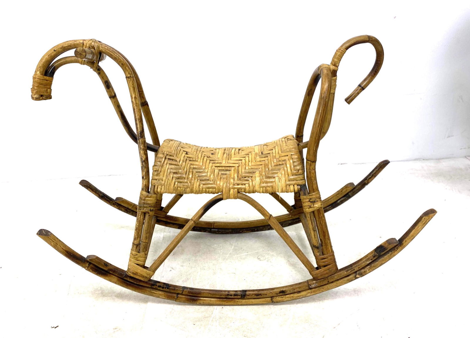 Franco Albini Style Rocking Horse. Woven Rattan.: Franco Albini Style Rocking Horse. Woven Rattan.-- Dimensions: H: 24 inches: W: 35.5 inches: D: 12.5 inches ---