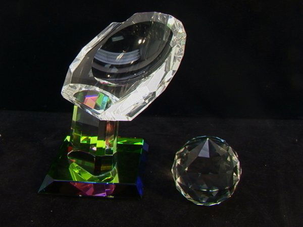 2 pcs CRYSTAL WORLD SWAROVSKI Sculpture. Swarovski: 2 pcs CRYSTAL WORLD SWAROVSKI Sculpture. Swarovski faceted iridescent crystal ball. Crystal World Crystal hand with Iridescent base. Swarovki signed. Crystal World is not signed. 2 PCS Dimensions: H: