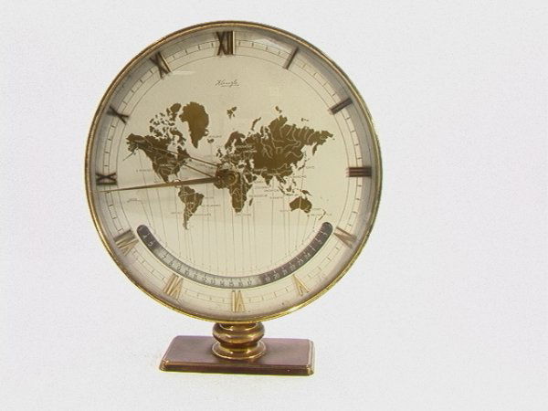 Rare KIENZLE Art Deco World Time Clock Bronze B: Rare KIENZLE Art Deco World Time Clock Bronze Bronze base and frame. Gold world map face and brass roman numerals Dimensions: Condition (General) Please contact us for a detailed condition report: Goo