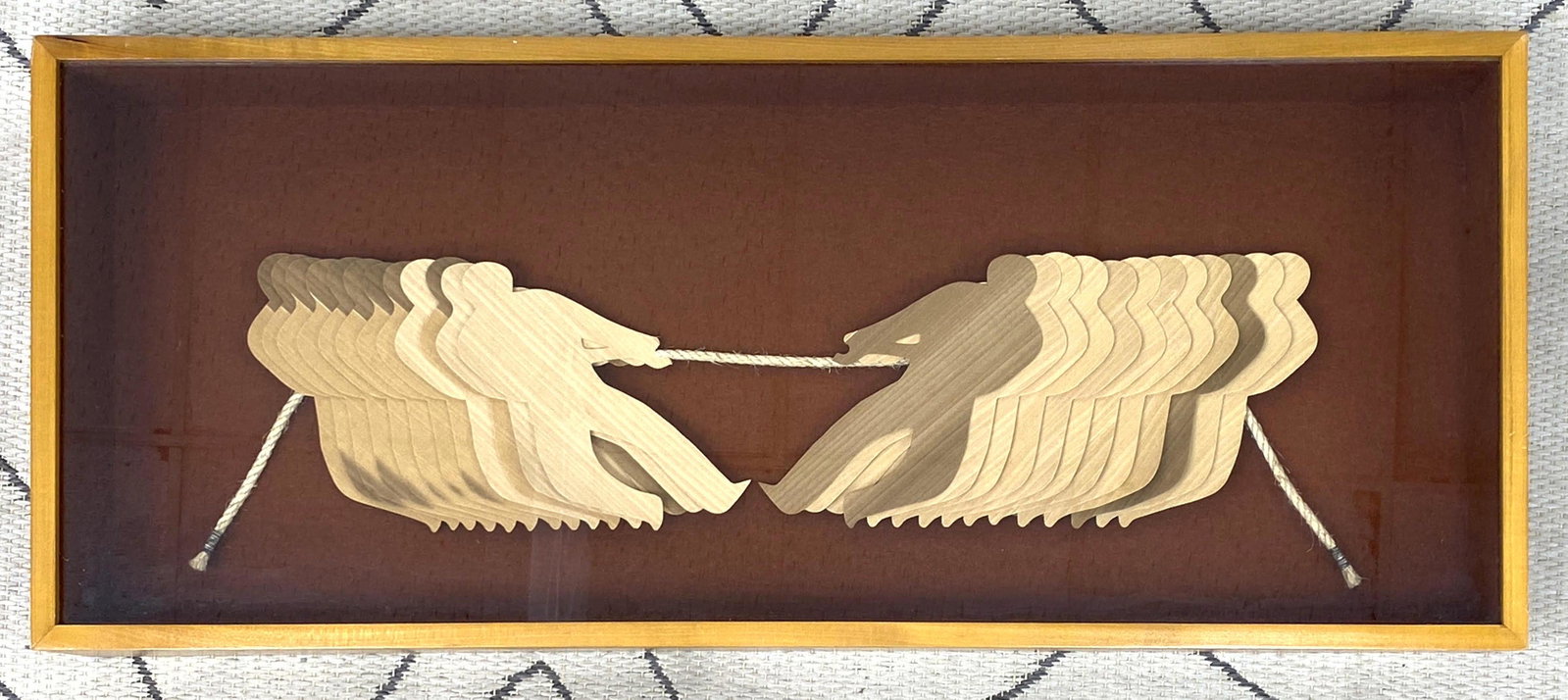 GREG COPELAND 1973 Shadowbox Sculpture. Wood veneers h: GREG COPELAND 1973 Shadowbox Sculpture. Wood veneers having tug of war. -- Dimensions: H: 15 inches: W: 36 inches: D: 4 inches ---