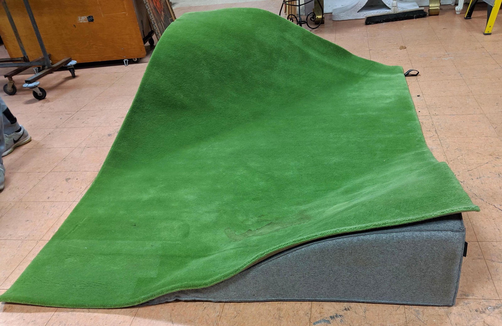 NANIMARQUINA Flying carpet seating by Ana Mir and Emili: NANIMARQUINA Flying carpet seating by Ana Mir and Emili Padros. 2 gray wedges with green carpet.-- Dimensions: H: 20 inches: W: 97.5 inches: D: 62 inches ---